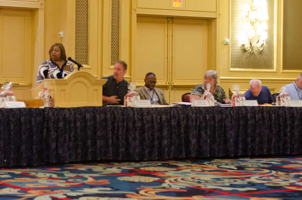 DSC8741.jpg Shaundra Clark speaks at the podium.