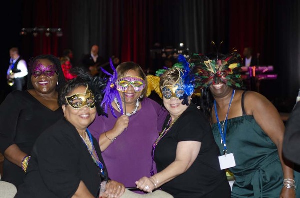DSC2183.jpg Four women wearing masks and smiling next to each other