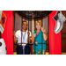 Two women posing in the Monopoly photo booth jail.