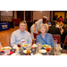 A man and a women posing at one of the dinner tables.