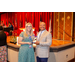 President Anthony Goodson Jr. Handing a glass award to a women.