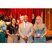 President Anthony Goodson Jr. posing with the two women he just handed glass awards to.