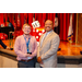 A man posing with his award with President Anthony Goodson Jr.