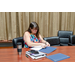 A woman putting awards into a certificate folders.