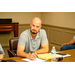 A man thinking avidly about the discussion occurring around the table.