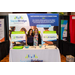 Two woman with their booth for Social Bridge Technologies.