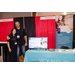 A man and a woman with their booth for Wynd Technologies.