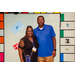 A couple posing with the Housingopoly game board backdrop.