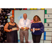 The people with Housingopoly props posing with the Housingopoly game board backdrop.