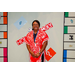 A close up of a woman in a red and white dress in the Housingopoly game board photo booth.