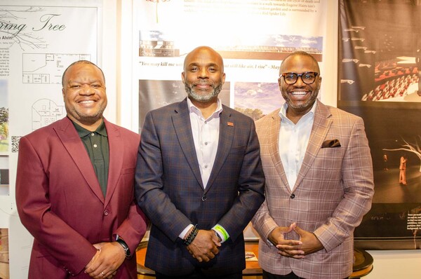 President Anthony Goodson, Jr and Treasure James Cox taking a photo with NAHRO President and CEO George Guy.