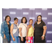 Five women taking a group photo in front of a Greensboro Housing Authority backdrop.