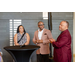 President Anthony Goodson, Jr. and Treasurer James Cox speaking with another woman to a crowd.