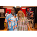 Two women posing in front of the Tough Tek Metals booth.