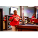 A woman holding a pool que at the pool table.