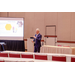 A man gesturing with his hands as he gives a presentation.