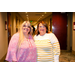 Two women wearing colorful shirts.