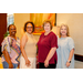 Four woman taking a group photo together.