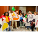 A group photo of individuals holding signs to represent different states.