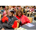 A woman with an arm around the gentleman next to her.