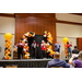 People on stage in the middle of a game of restacking cups.