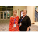 Two women smiling for the camera in a lobby.