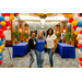 Three women posing under a balloon arch.