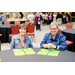 Two women with four Bingo cards each.