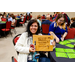 A woman holding up a cutting board that says Shark Coochie Board, because No One Can Say Char-cuterrie.